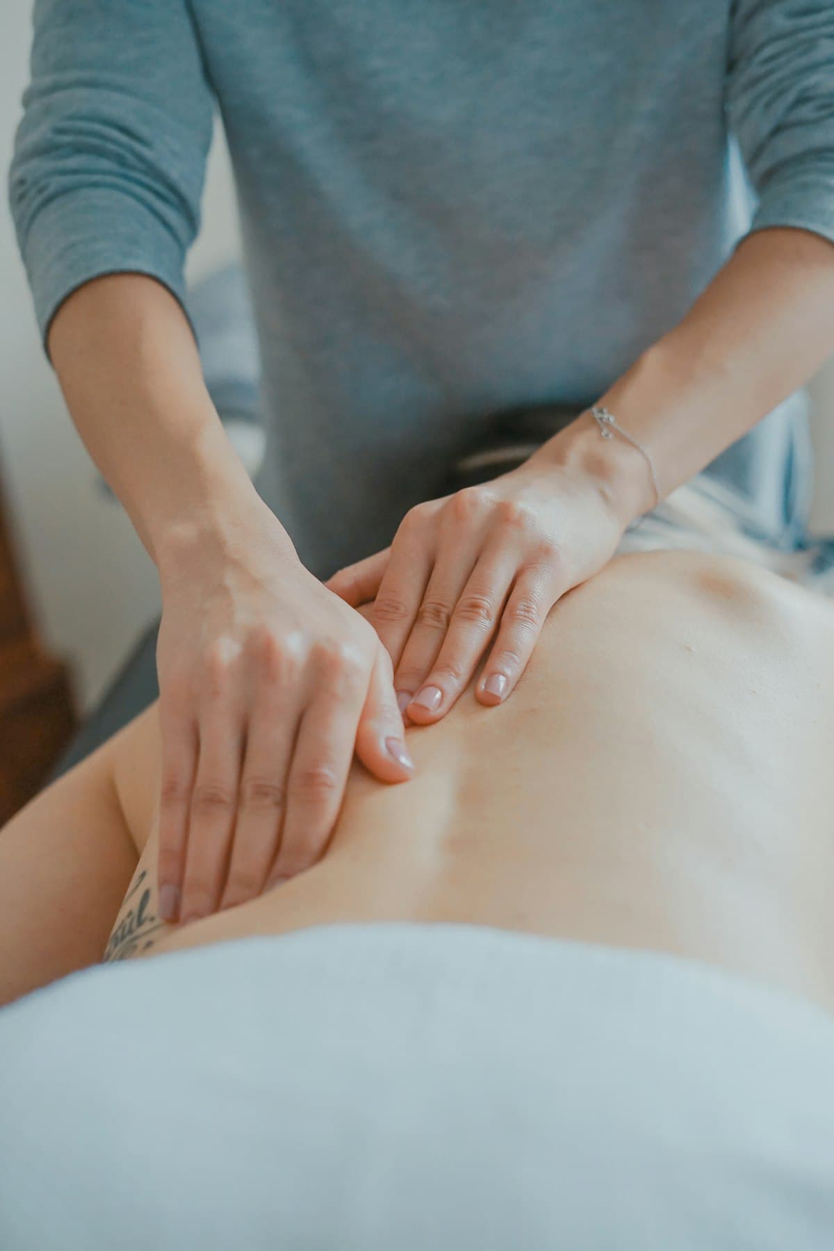 Therapist working through the back during a therapeutic massage